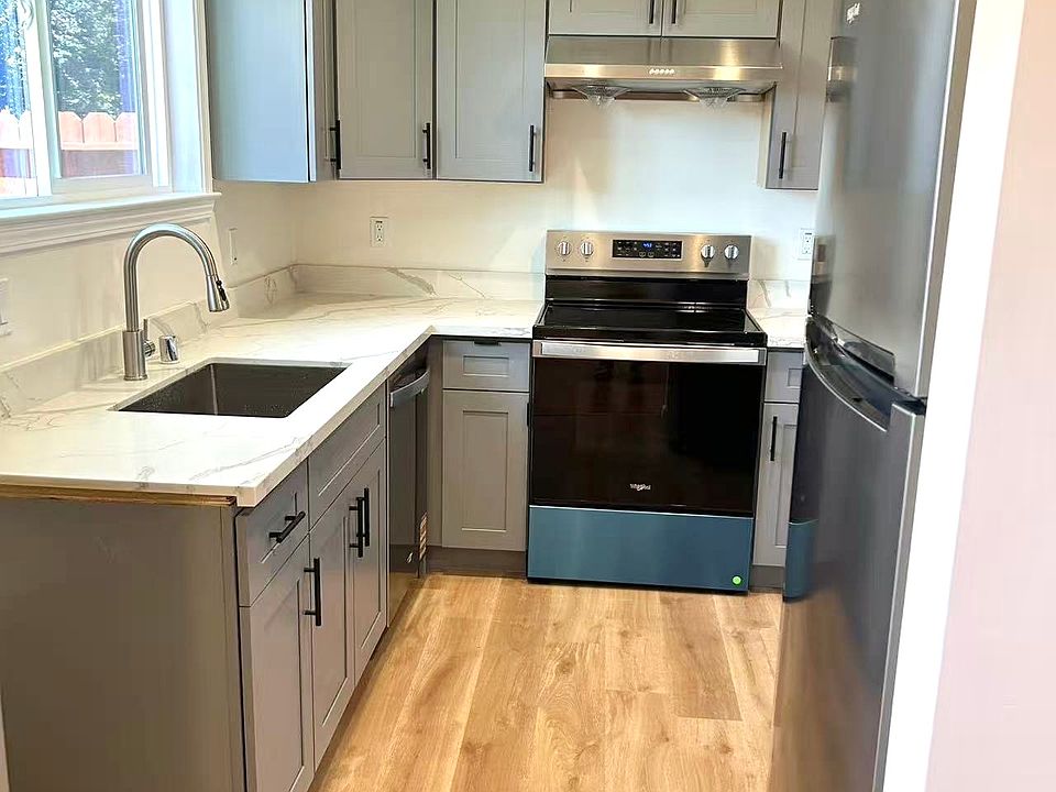 BRAND-NEW kitchen with NEW quartz countertops, NEW shaker cabinets, NEW Whirlpool stainless-steel appliances.