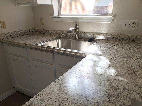 Updated kitchen with new countertop includes bright south window
