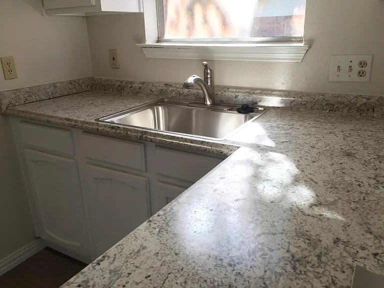 Updated kitchen with new countertop includes bright south window