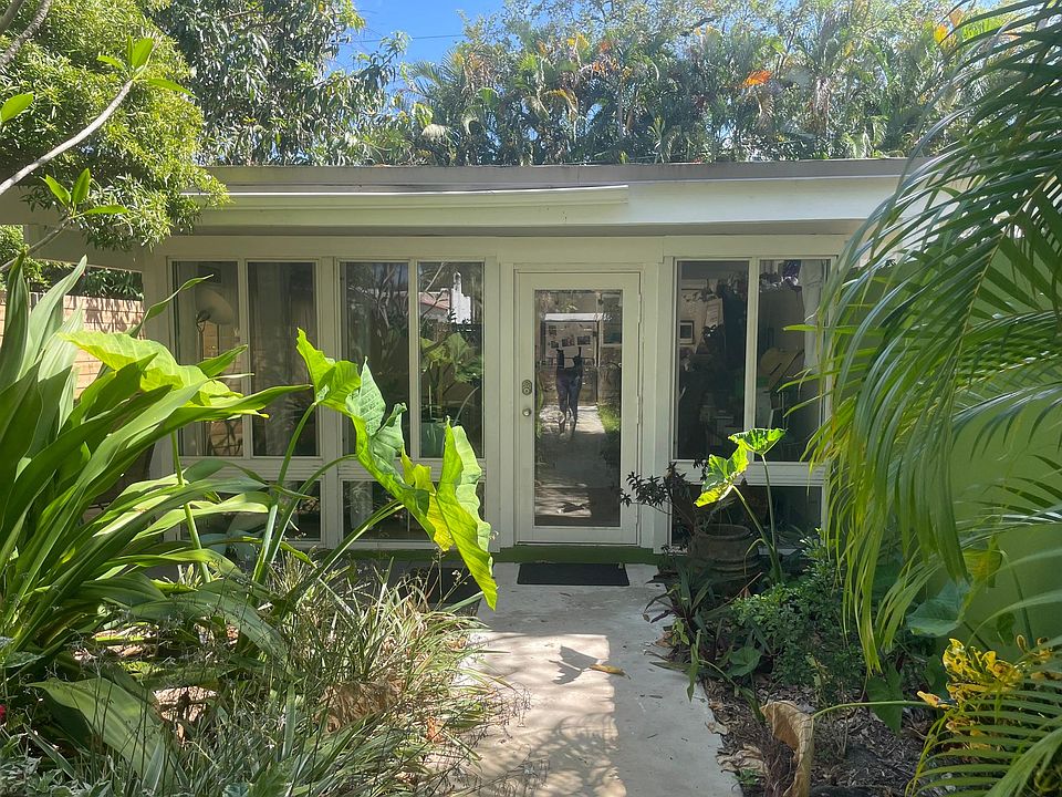 Tropical foliage by front door