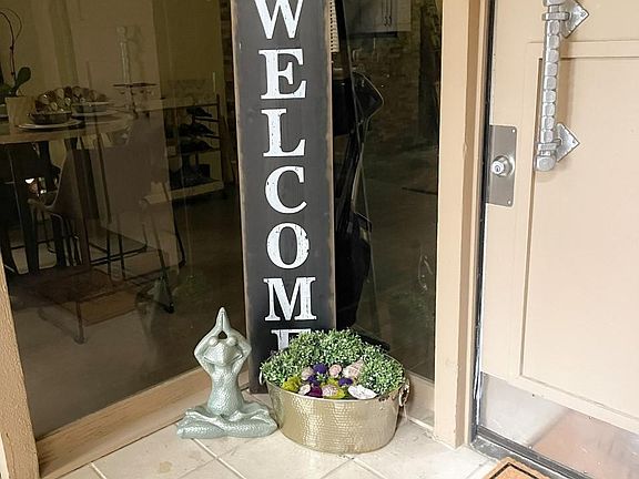 Serene entrance with patio seating area