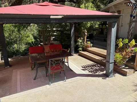 Gazebo below driveway