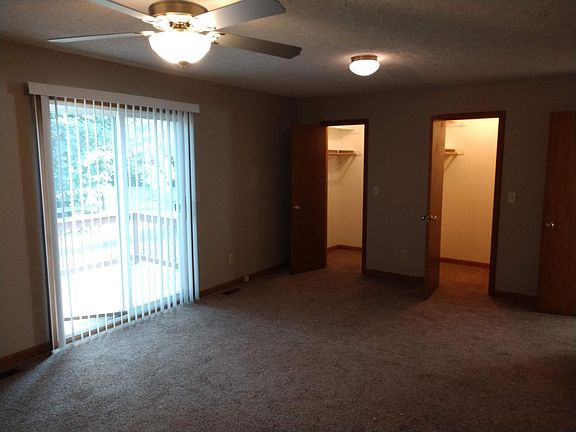 Master Bedroom with double walk in closets and ceiling fan