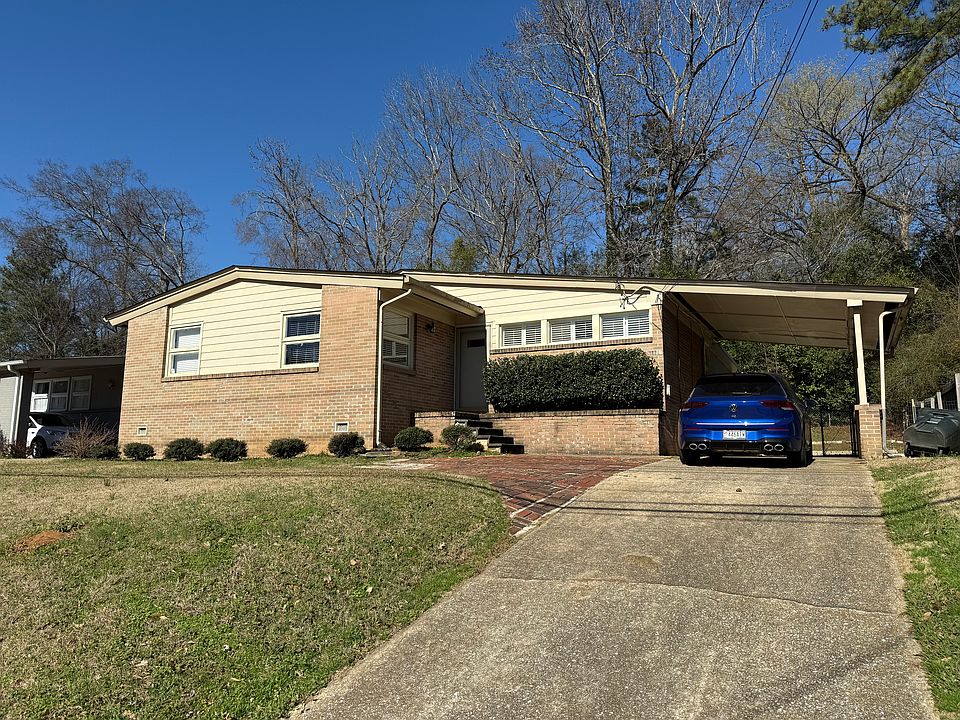 Front of house with parking pad.