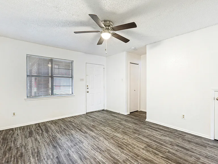 Living room with front entrance door.