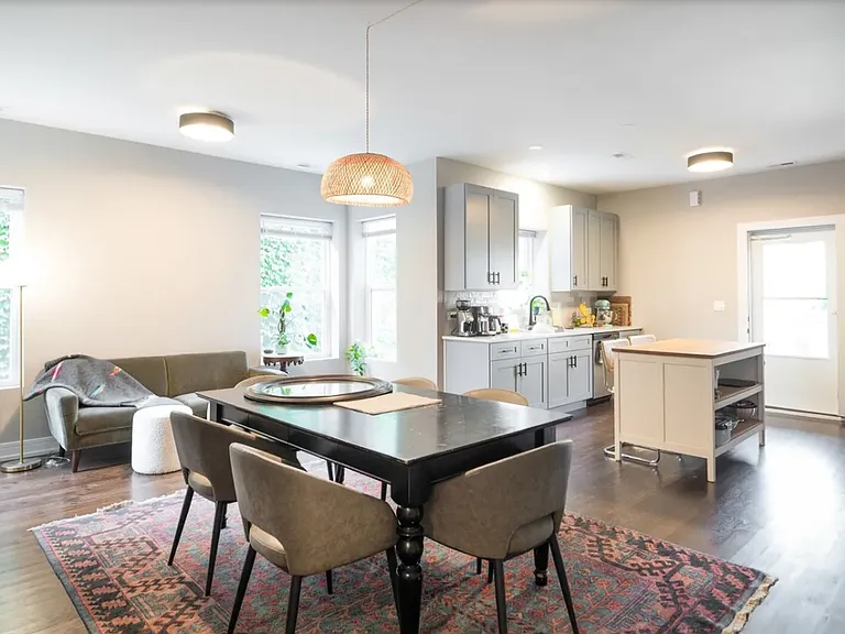 Massive, open-concept dining and living area connected to kitchen