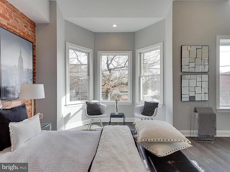 Master Bedroom: Dramatic Lighting, Exposed Brick, 10'+ Ceilings, Bay Window