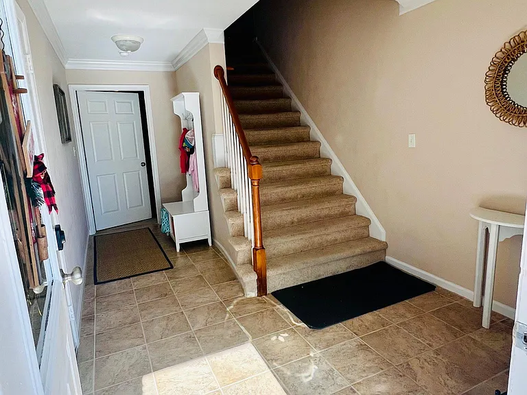 Large entryway with door to 1st floor master and garage