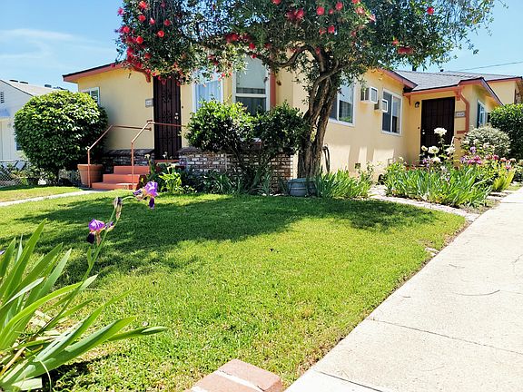 This is the front unit of two that are rentals. surrounded with lovely plants.