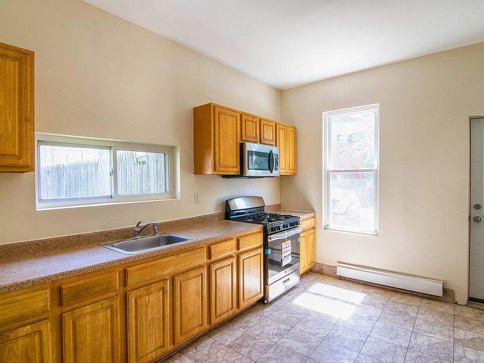 Large bright kitchen with new stainless appliances