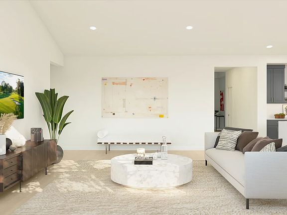 Great room with vaulted ceiling and low-profile LED lighting