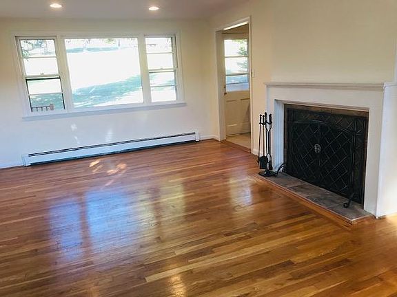 Living room with wood burning fire place