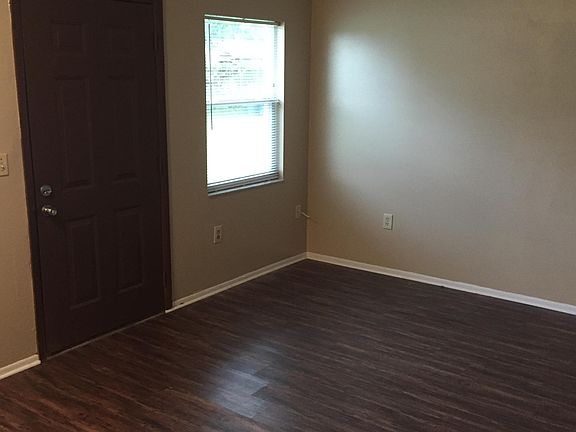 Living room with vinyl plank flooring.