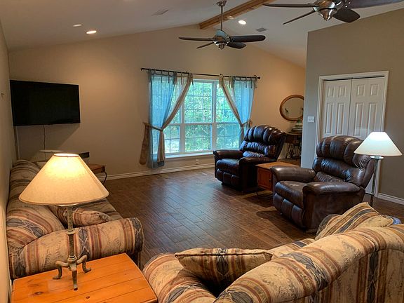 Living area with large Screen TV. Lots of ambient light