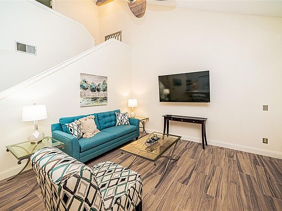 Family room with vaulted ceilings and wood floors
