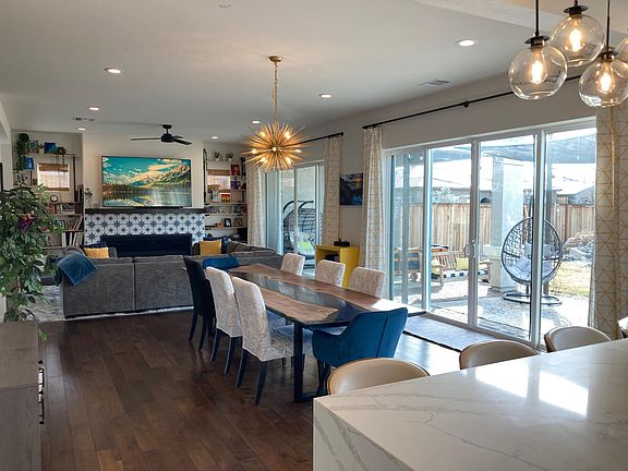 Design to entertain! 11 ft river table, waterfall quartz bar seating, 3 wrap around sectional, wall to wall Mt Rose views, 72" linear fireplace, +++