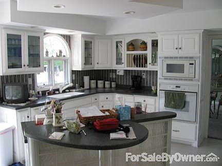 remodeled kitchen & breakfast room
						:
						Island in center of kitchen with a solid surface stovetop
.