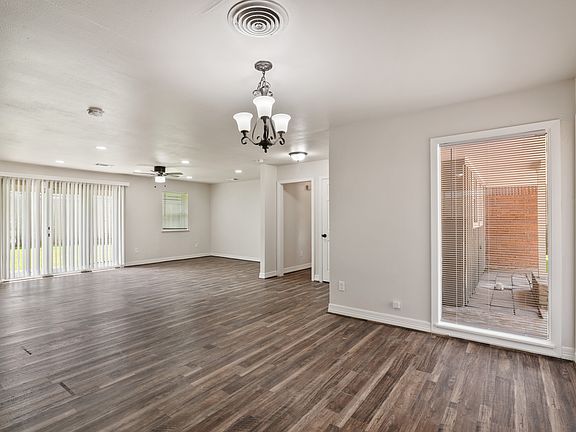This spacious living and dining area is filled with natural light