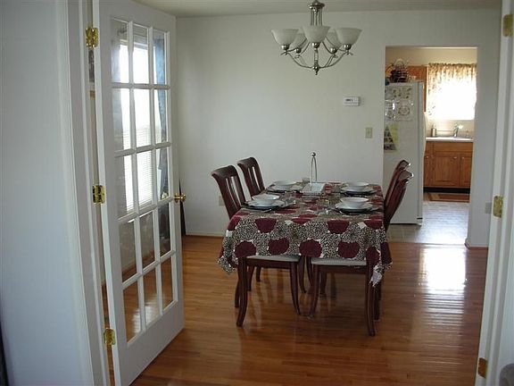 The gleaming hardwood flooring adds a touch of elegance. 