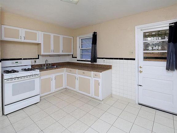 Large kitchen opens out to huge back yard.