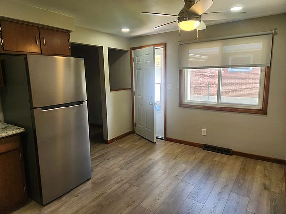 Kitchen door leading out to fenced yard