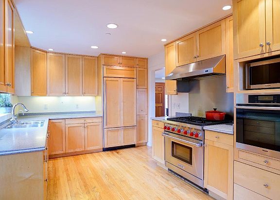 Modern kitchen with professional stove and built-in Sub Zero refrigerator. Quartz counter tops will be newly installed on 7/1.