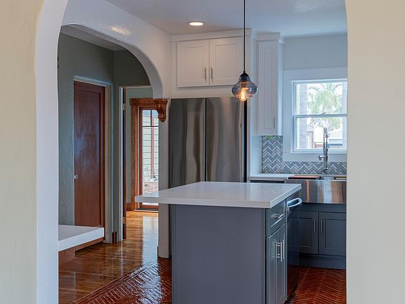 Arch pass-through from living room to kitchen