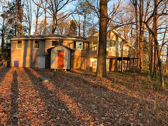 Back of house including storage shed