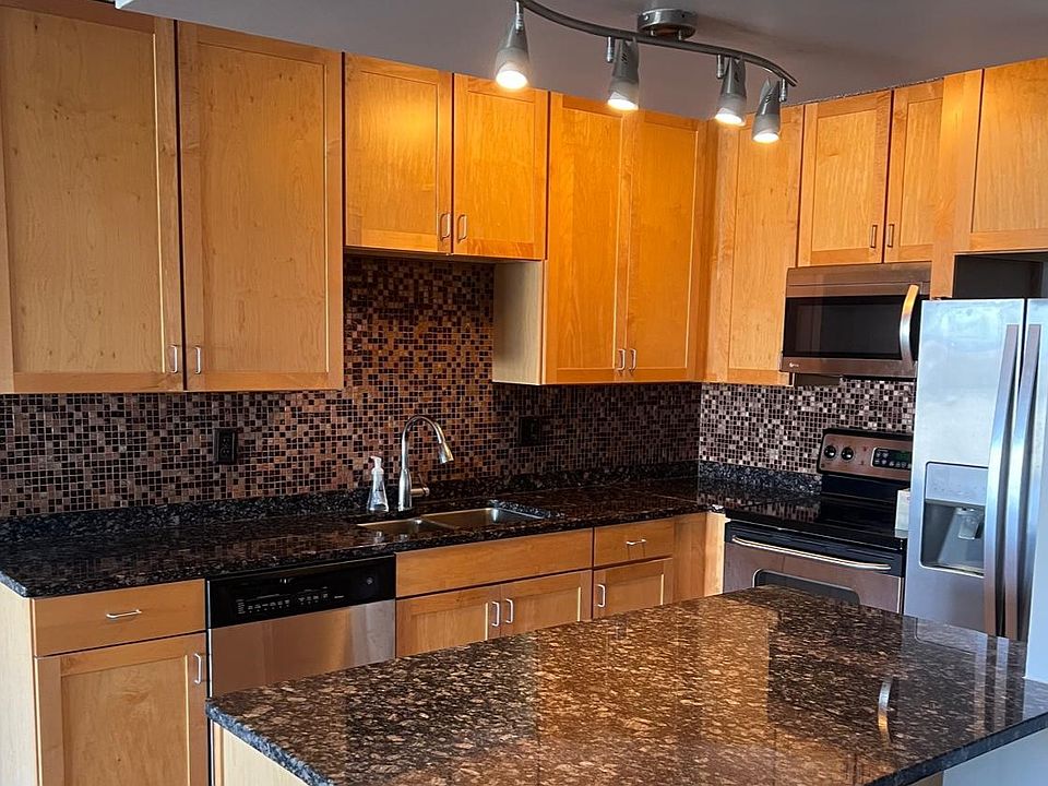 Kitchen with grantie counter top and stanless steel appliances