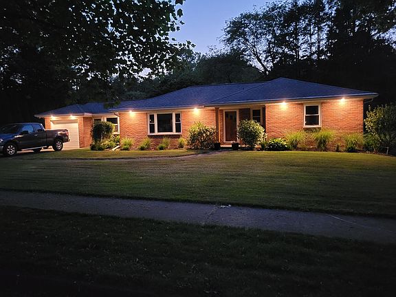 Front of house with automatic evening landscape lighting