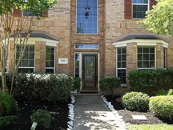 BAY WINDOWS IN FORMAL DINING & STUDY , EXTERIOR ACCENT SHUTTERS & MATURE STONE-LINED LANDSCAPING CREATES BALANCE AND STABILITY.   AN ATTACHED 3-CAR TANDEM GARAGE HAS PLENTY OF ROOM FOR YOUR VEHICLES AND OUTDOOR GEAR.