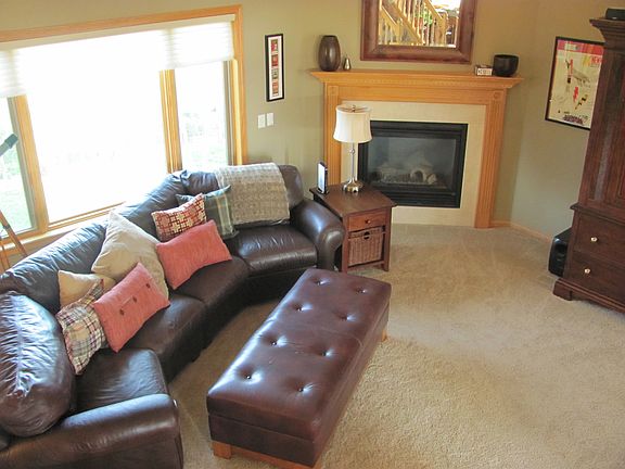 Living room with vaulted ceiling and gas fireplace