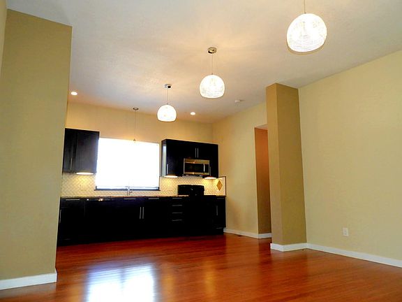 View looking towards kitchen from living room space