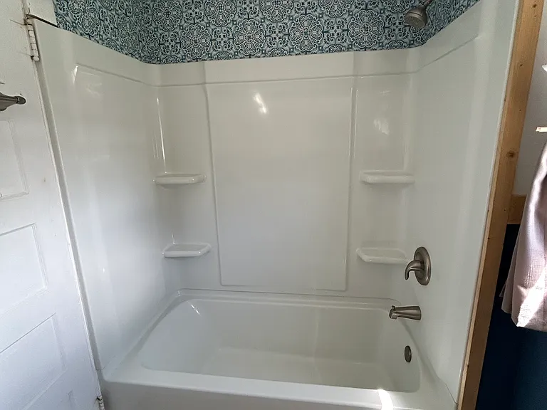 Check out the shower, freshly installed last year! Cute tiles add a splash of style and seriously elevate this cozy space. It's where practical meets pretty_because even small bathrooms deserve a glow-up. Time to scrub up in style!
