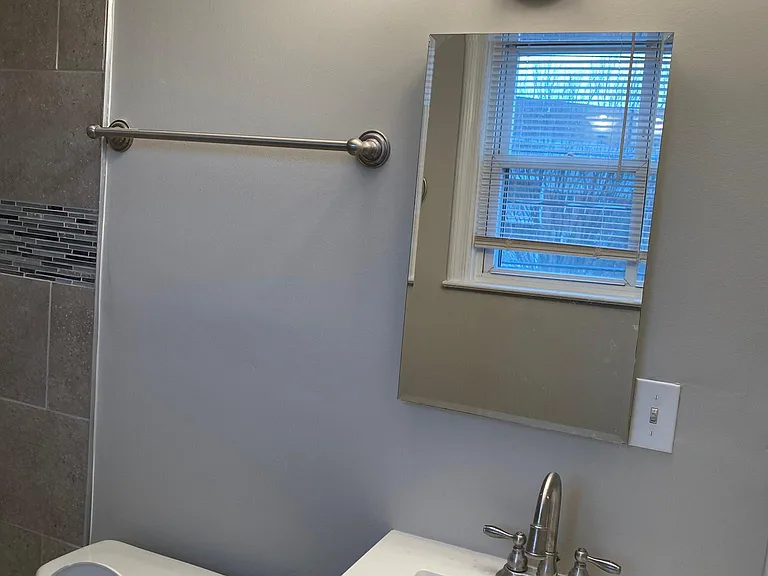 bathroom sink and medicine cabinet