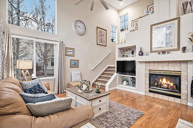 Open floorplan with fireplace and big screen tv