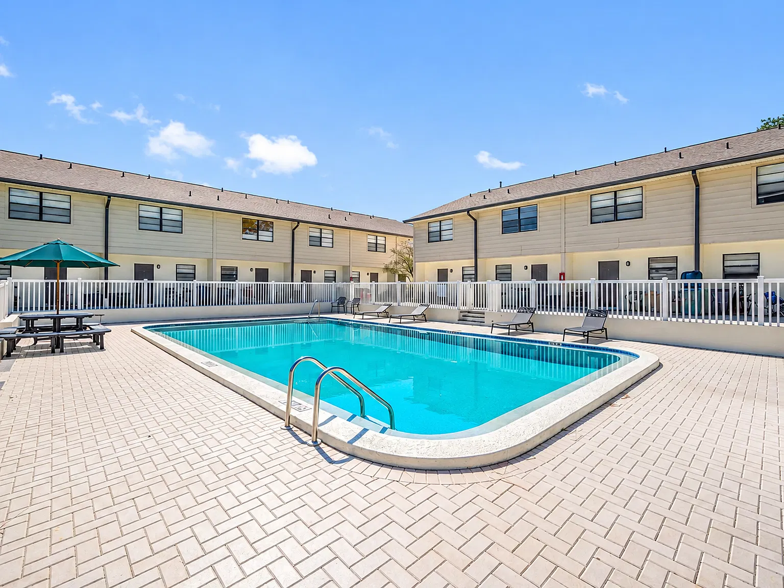 Spacious Renovated 2BR Townhome | 2.5 Baths, Pool & Private Laundry! — Photo 4