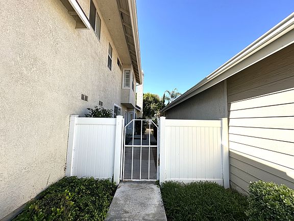 Gate entrance to front door and side yard.