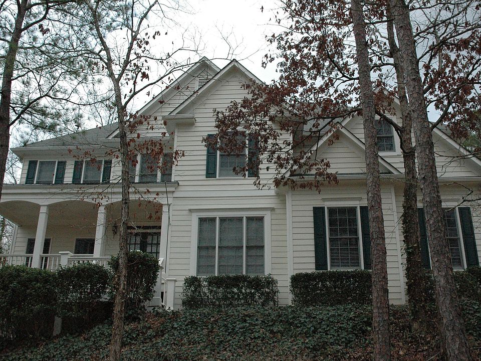 Immaculate home on private wooded lot adjacent to Lake Lanier Corps property. 