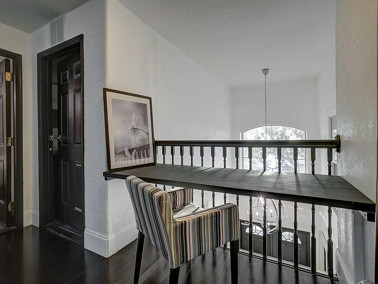 Inspiring Workspace - Catch up on emails or dive into productive work with views overlooking the 20-foot tall entry foyer.