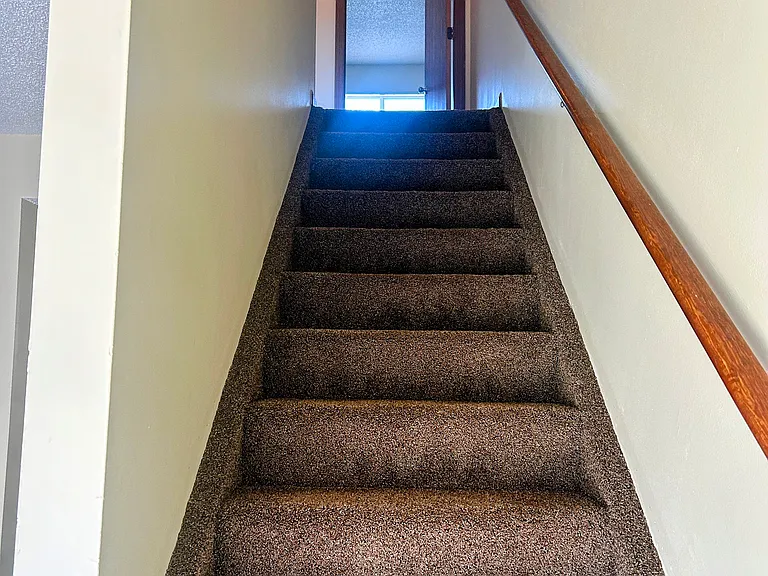 Stair way and master bathroom door way