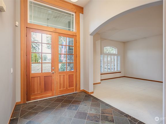 The front door, house entry, and living room.>