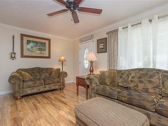 Living room with charming entry door.