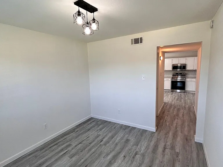 Dining rom leading to kitchen