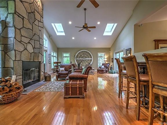 Impressive floor to celing stone wood burning fireplace!