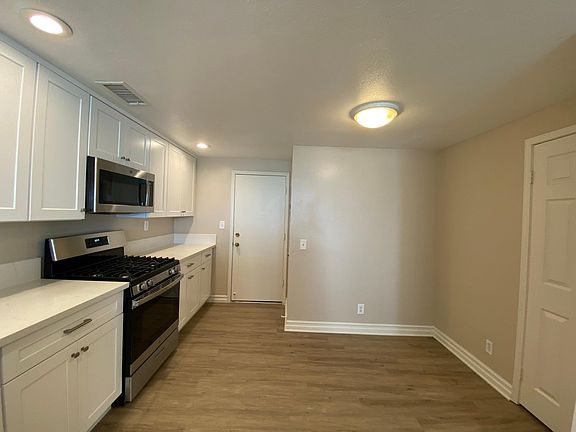 Kitchen has a small eating area and a pantry, direct access to the 2 car garage