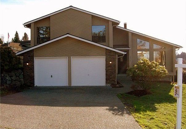 Great curb appeal this home has fresh exterior paint and rich stone accents perched on a large view,