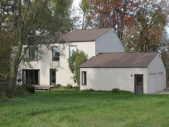 Stained siding blends into the natural feel this home presents.