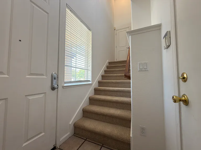 Front Door + Stairs To Level 1 + Garage Door