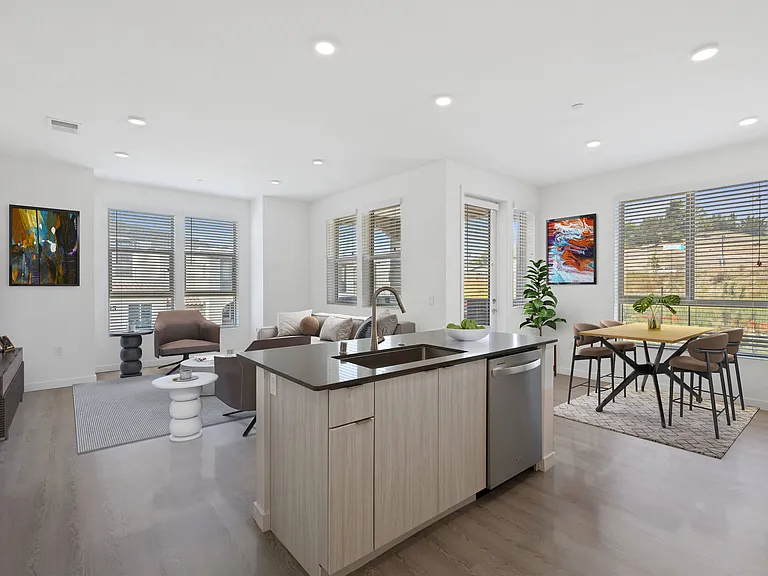 Embrace the natural light in an open concept floor plan, featuring large, inviting windows that bring the outdoors in.